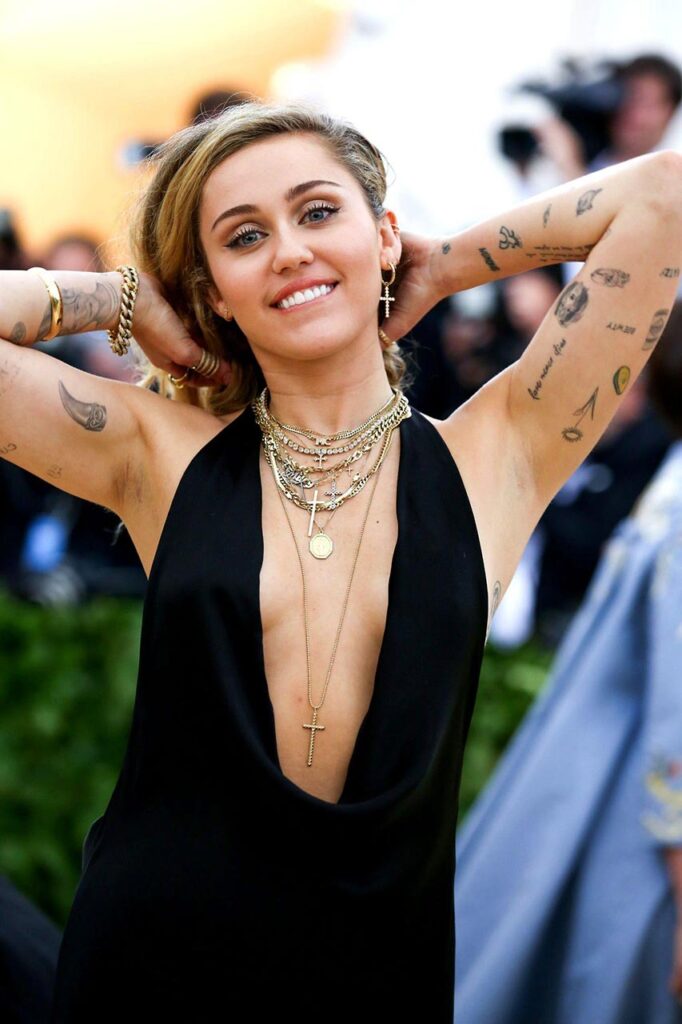 naked Miley Cyrus tits bikini big boobs
